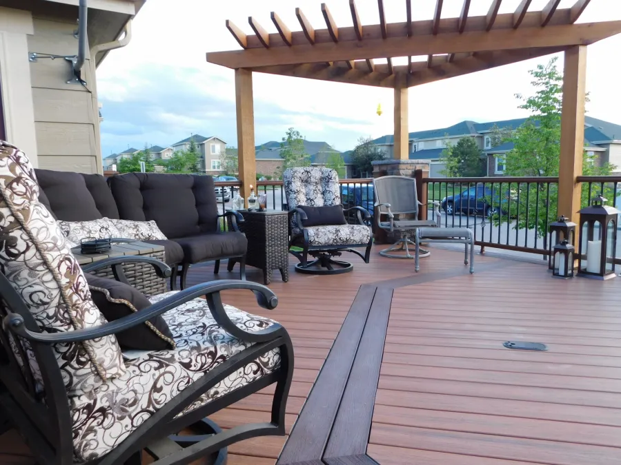 Custom Decks Tiki torch deck features double inlays borders in Trex Vintage Lantern Redwood pergola angled fire wall kitchen bar Aurora Colorado