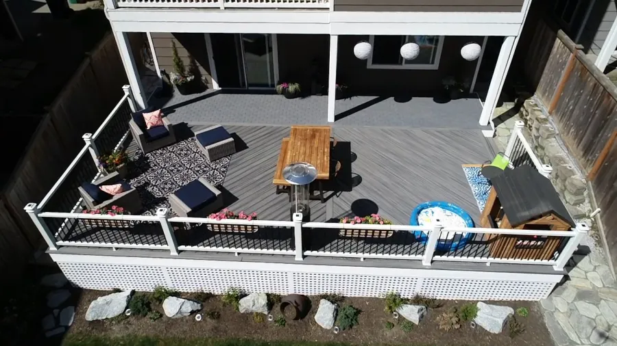 Custom Decks mixed materials decking is trex island mist completed white fascia and trex lattice in white Azek patio bothell washington