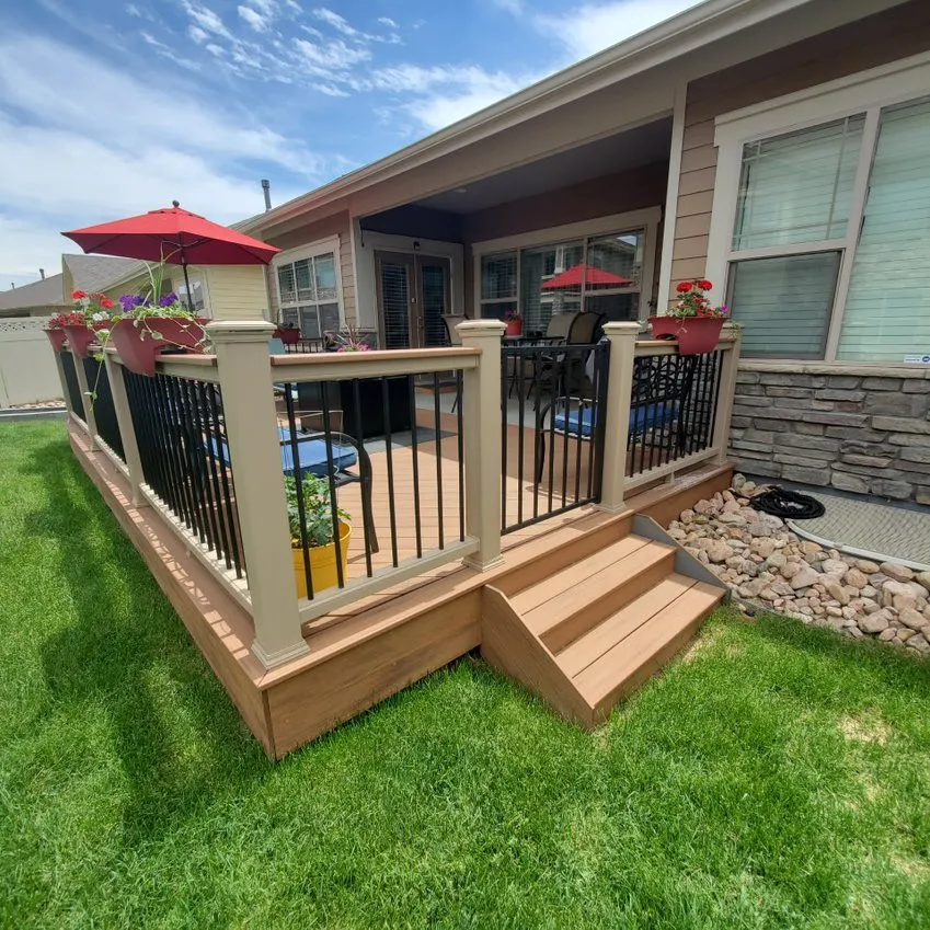 Custom Decks patio expansion trex tiki torch transcend railing rope swing with black balusters tiki torch cocktail cap aurora colorado