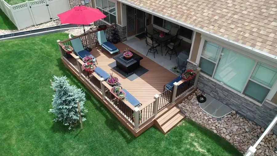 Custom Decks patio expansion trex tiki torch transcend railing rope swing with black balusters tiki torch cocktail cap with gate aurora colorado