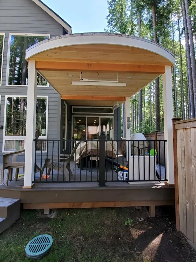 Custom Decks custom patio cover white posts cedar tongue and groove two heaters four can lights Bellevue Washington