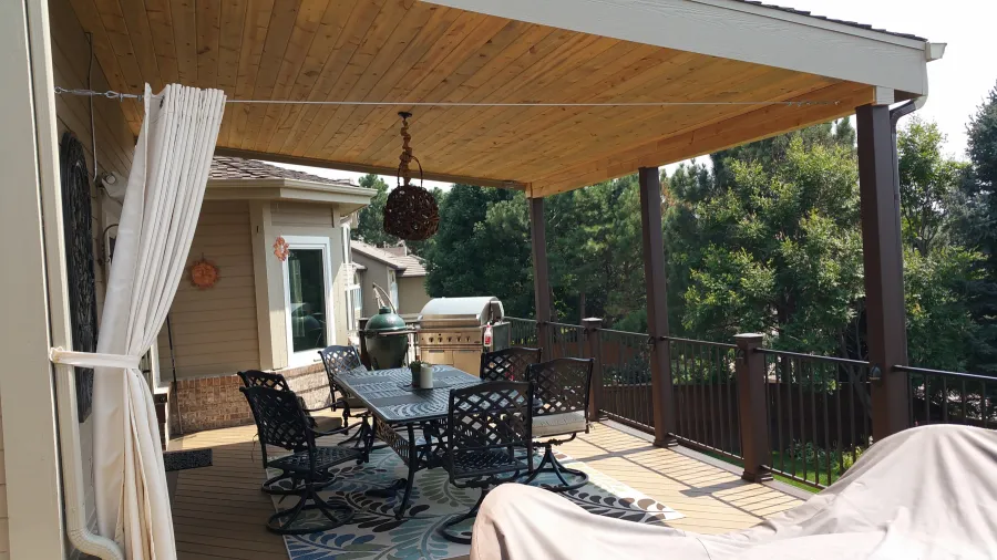 Custom Decks shed style roof beetle kill tongue and groove posts wrapped in Trex aurora colorado