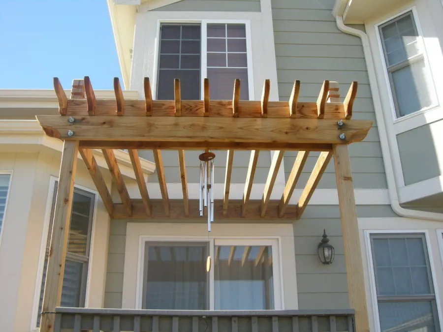 Custom Decks standard wood pergola 4x4 posts 2 2x8 beams 2x6 rafters resting on top Centennial Colorado