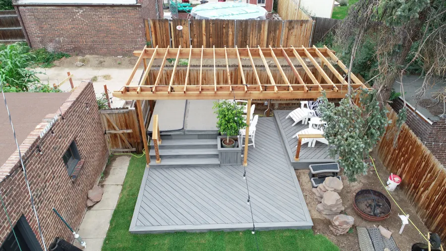 Custom Decks standard wood pergola 4x4 posts 2 2x8 beams 2x6 rafters resting on top Denver Colorado